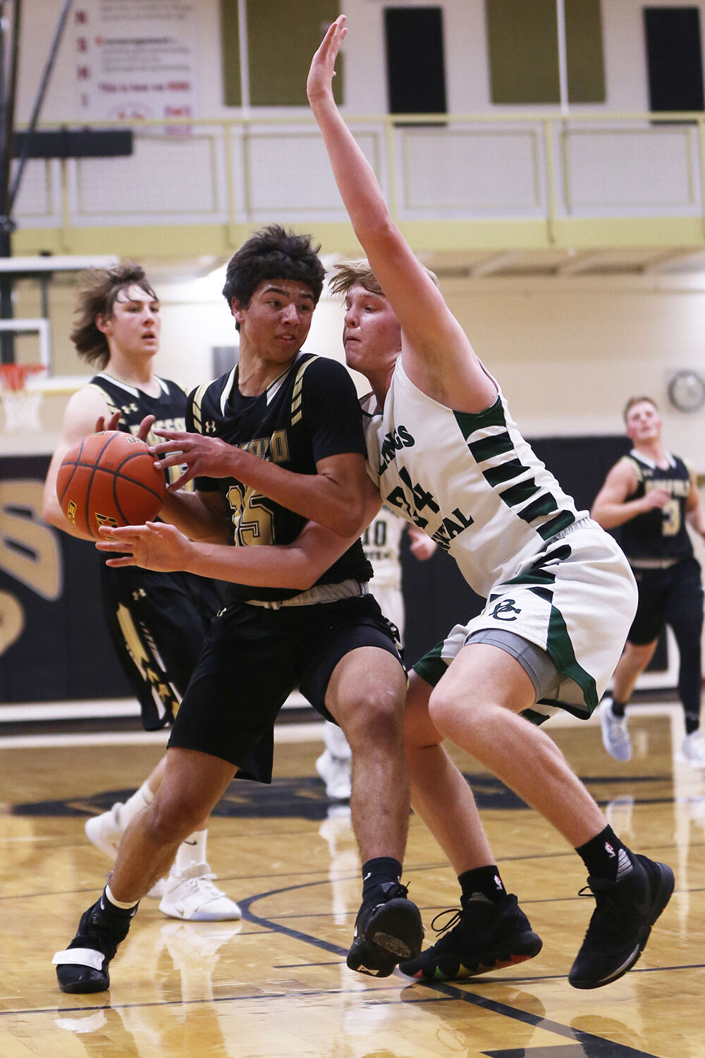 Eli Patterson pushes through Billings Central freshman Brock Blatter